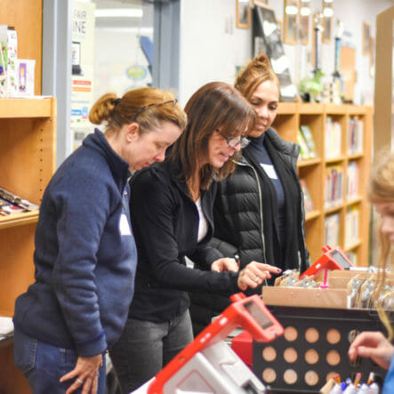 Parents volunteer at school book fair