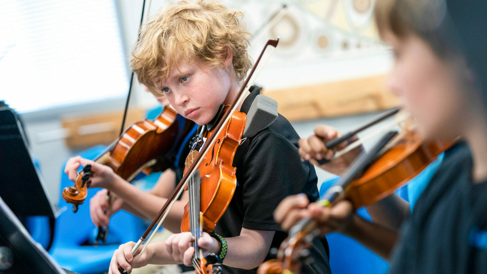 Young Students Playing Violins