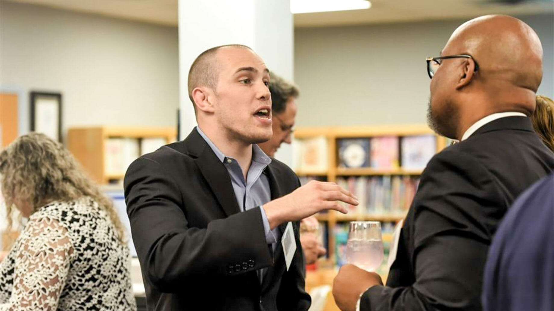 Alumni Socializing in Library