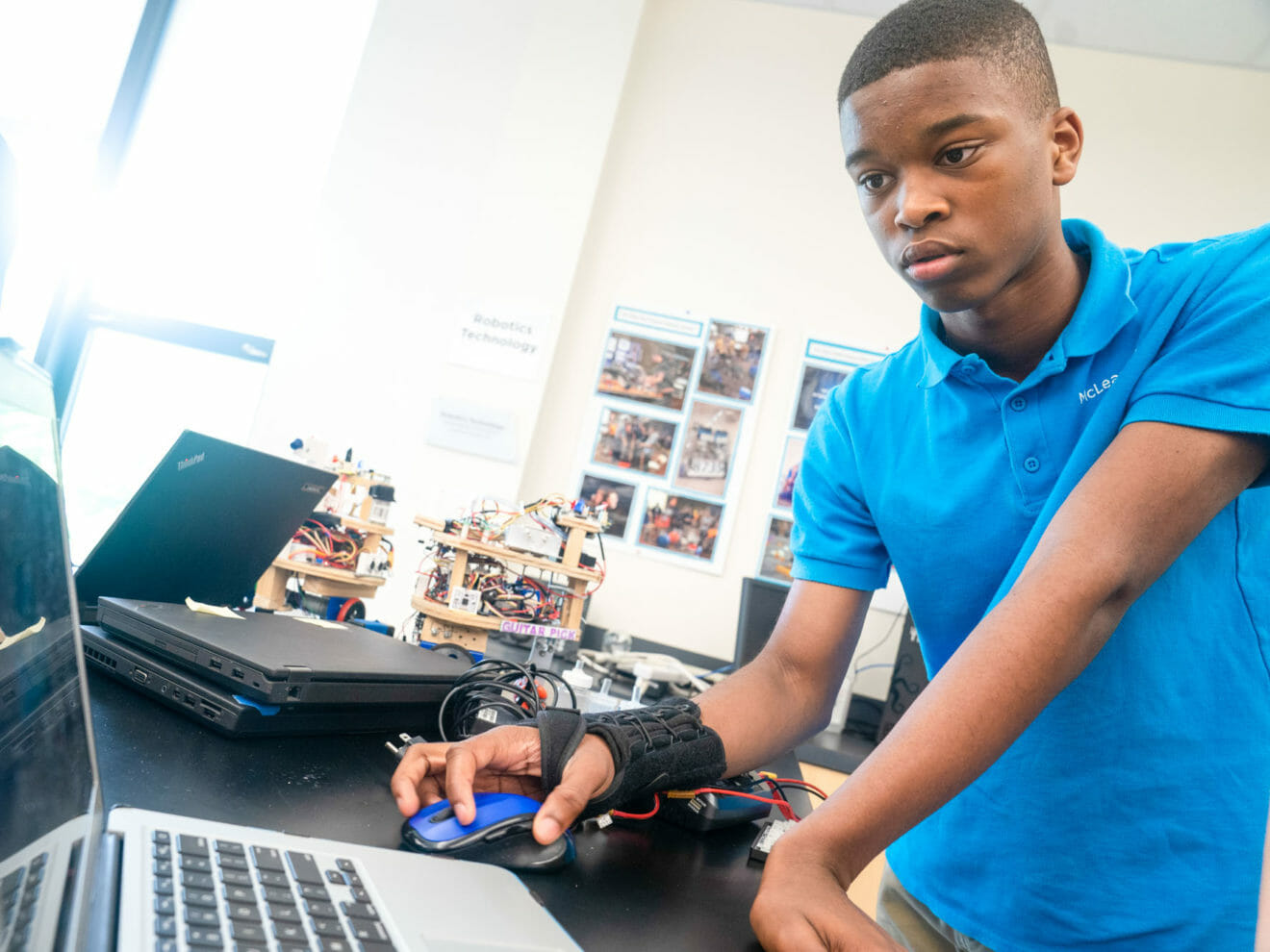 Student uses laptop during robotics project