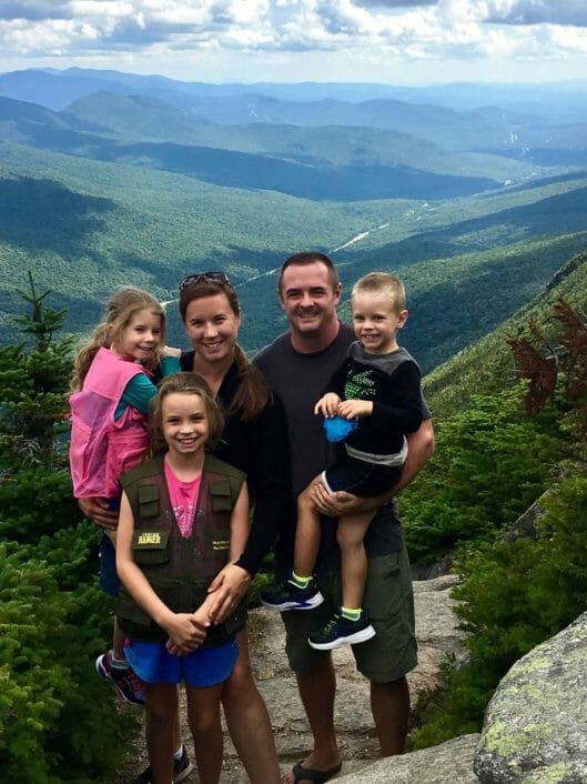 Michelle Fitzgerald, a Grade 4 teacher at McLean, posing with her family at the top of a mountain
