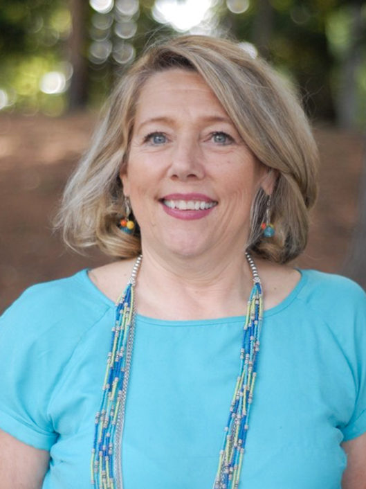 Frankie Engelking, McLean's Director of Student and Community Wellness, smiling while standing outside