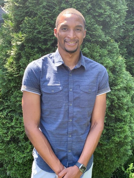 Jakobi Jackson, Grade 2 teacher at McLean School, smiles at camera