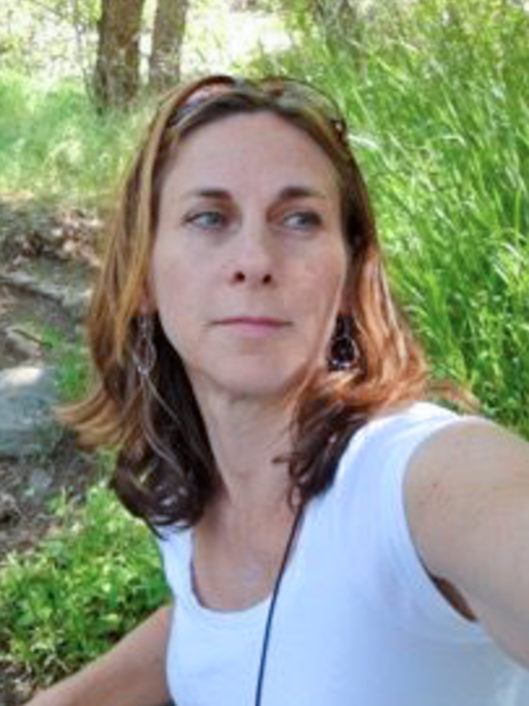 Allison Joseph, Grade 3 teacher at McLean School, looks off camera while outside