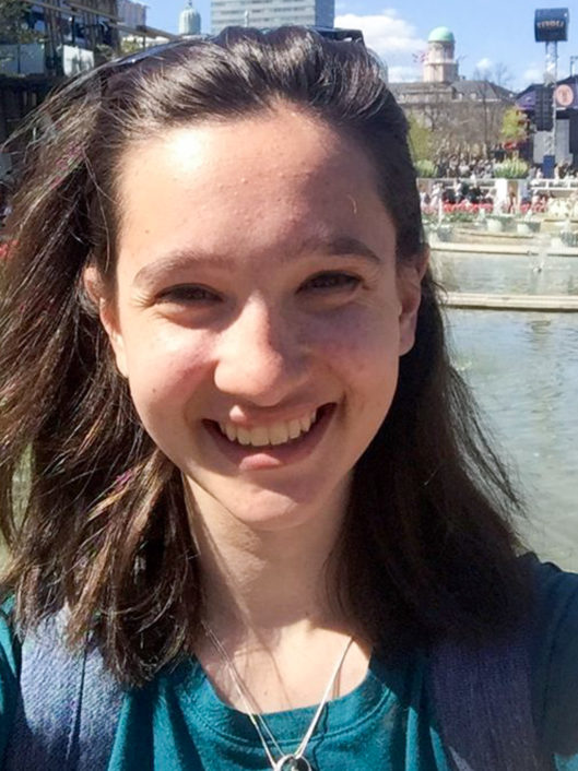 Sydney Murphy, Grade 4 teacher at McLean School, smiles at camera on a sunny day