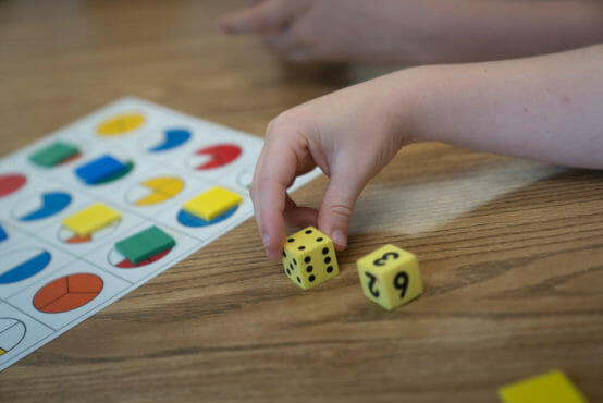 child using dice