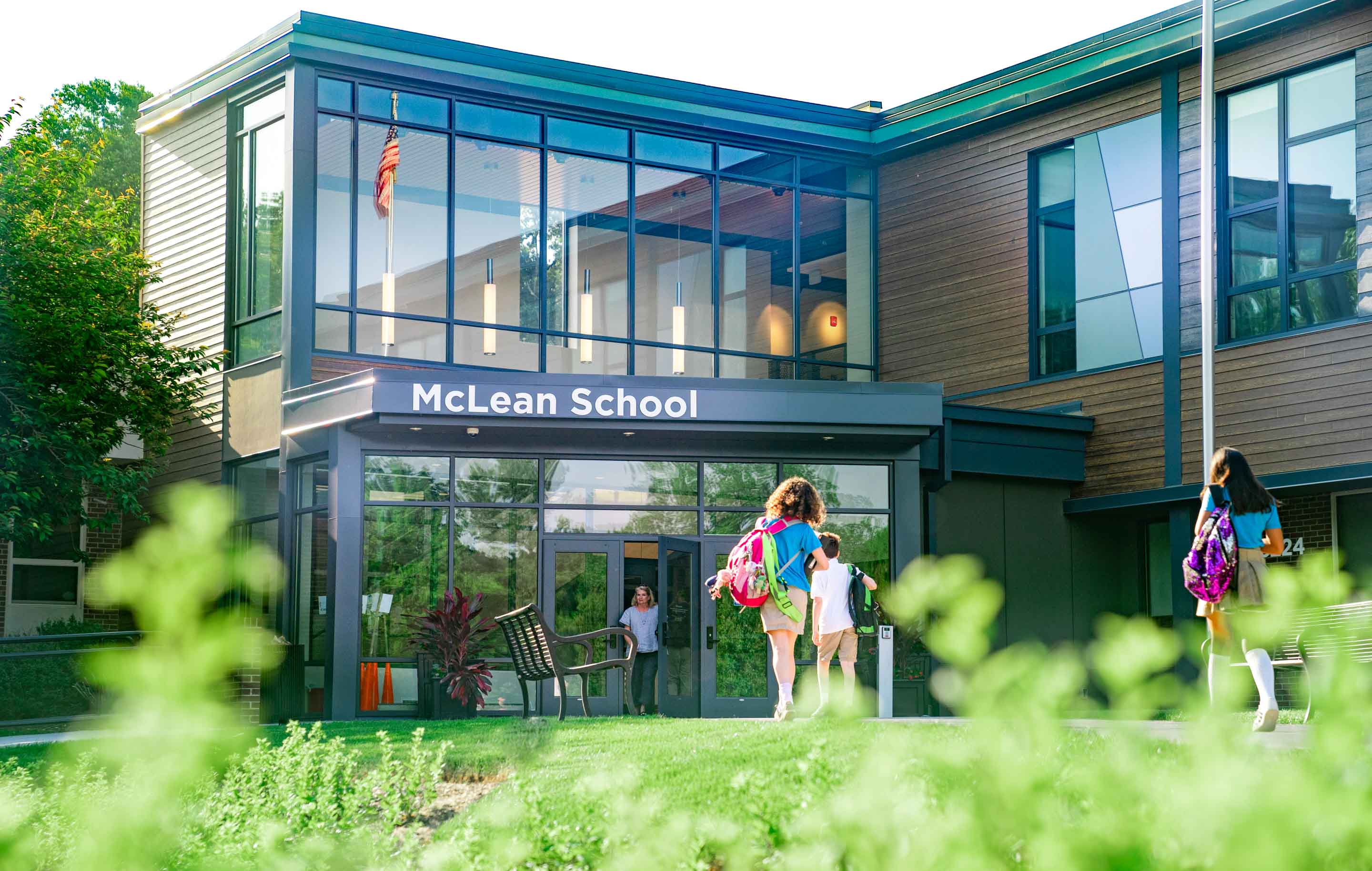 Students approach front door of McLean School