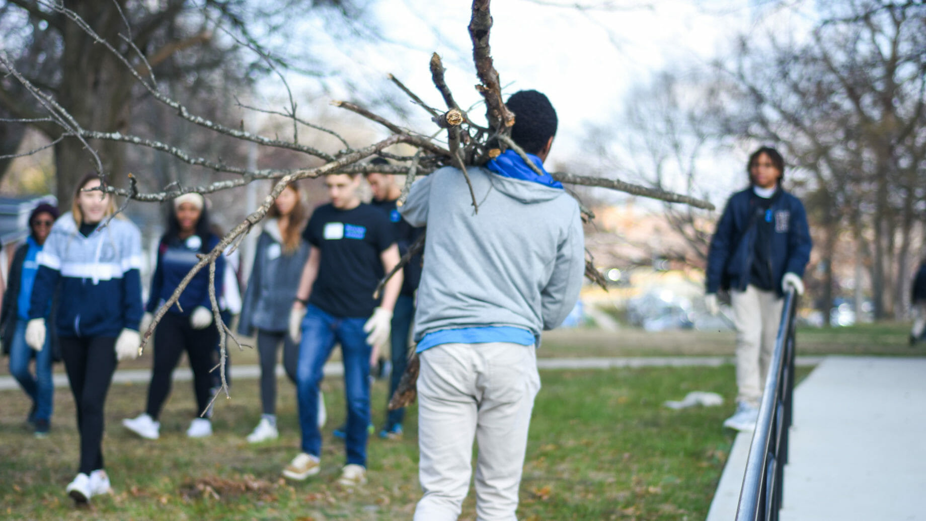 Students Cleaning Up Tree Branches