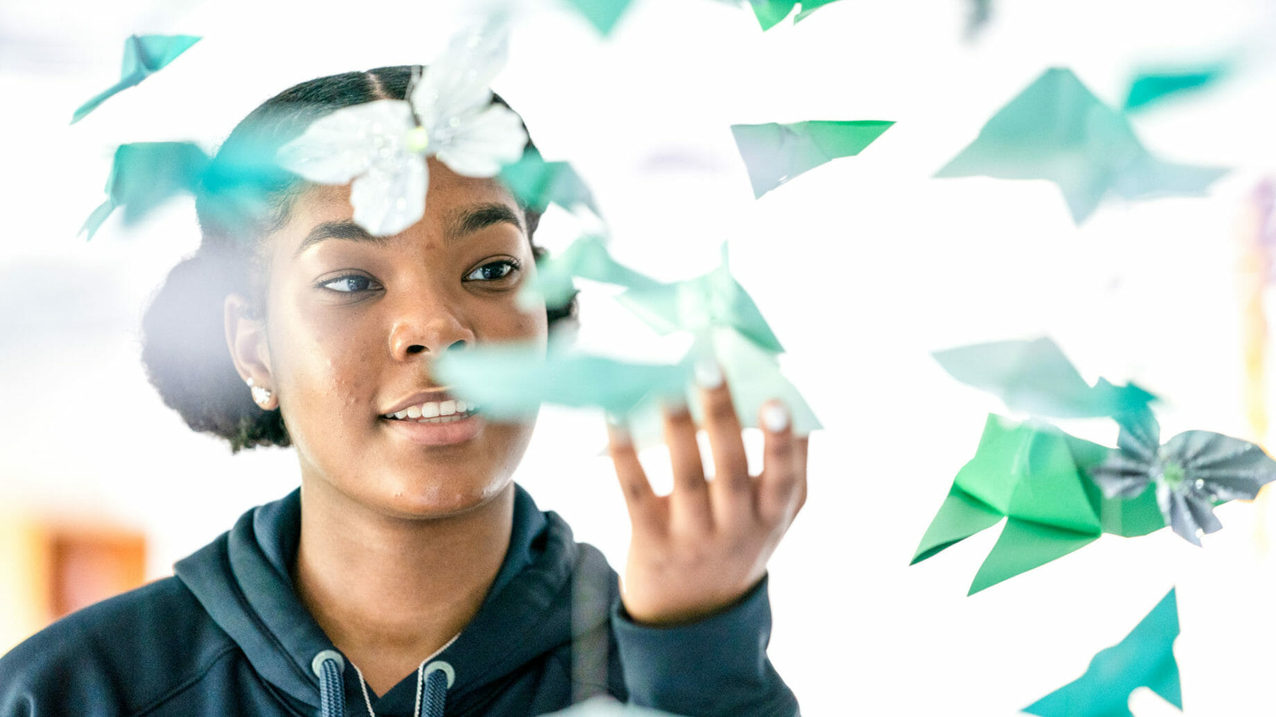 Student Grabbing Paper Shapes