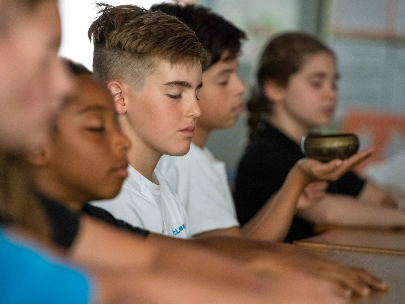 Group of students practice mindfulness