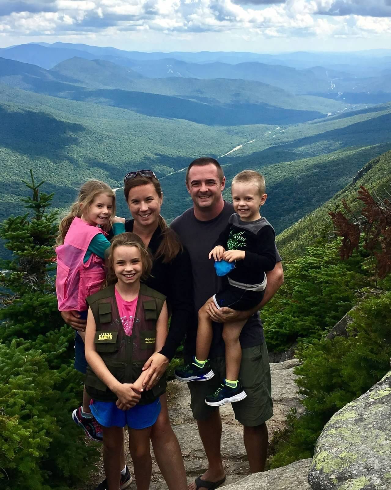 Michelle Fitzgerald, a Grade 4 teacher at McLean, posing with her family at the top of a mountain