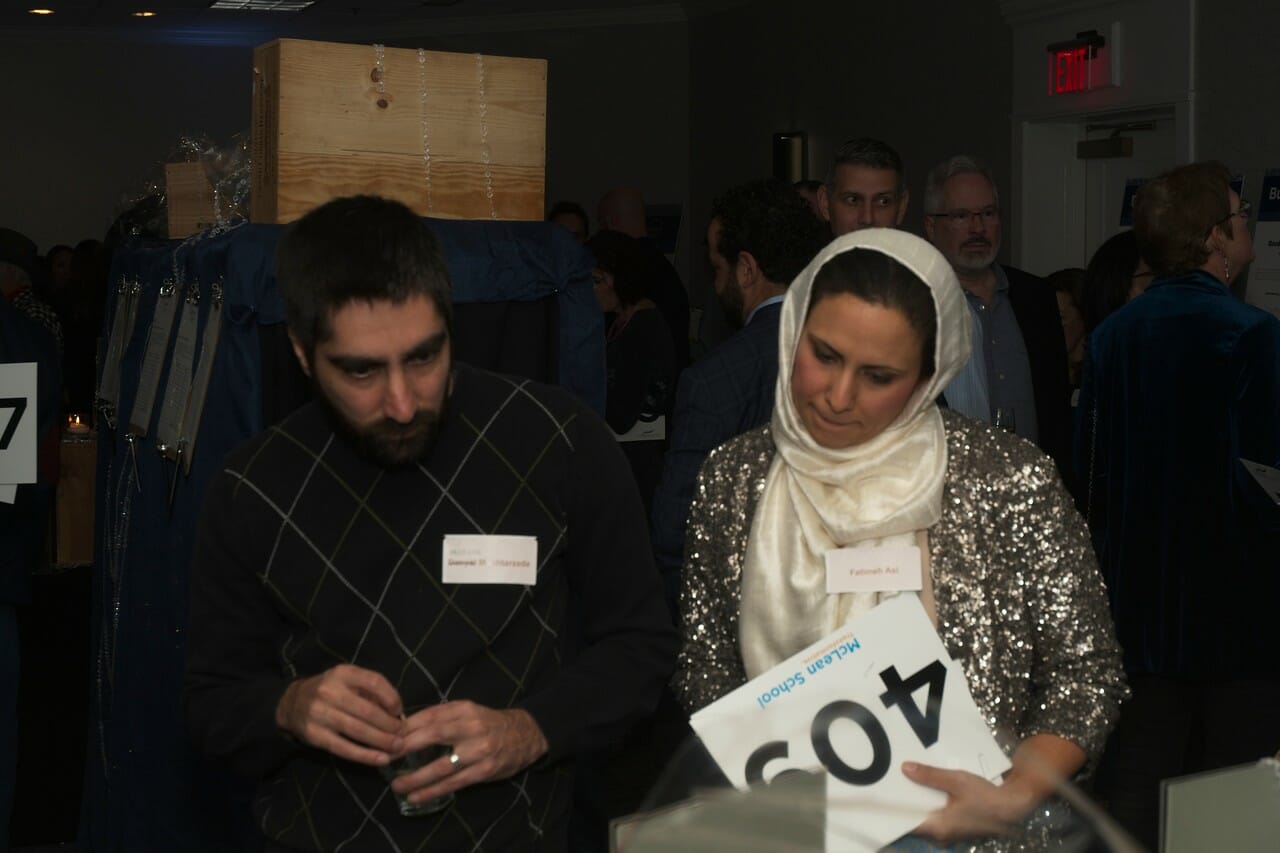 a man and a woman looking down