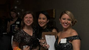three women posing at a McLean event