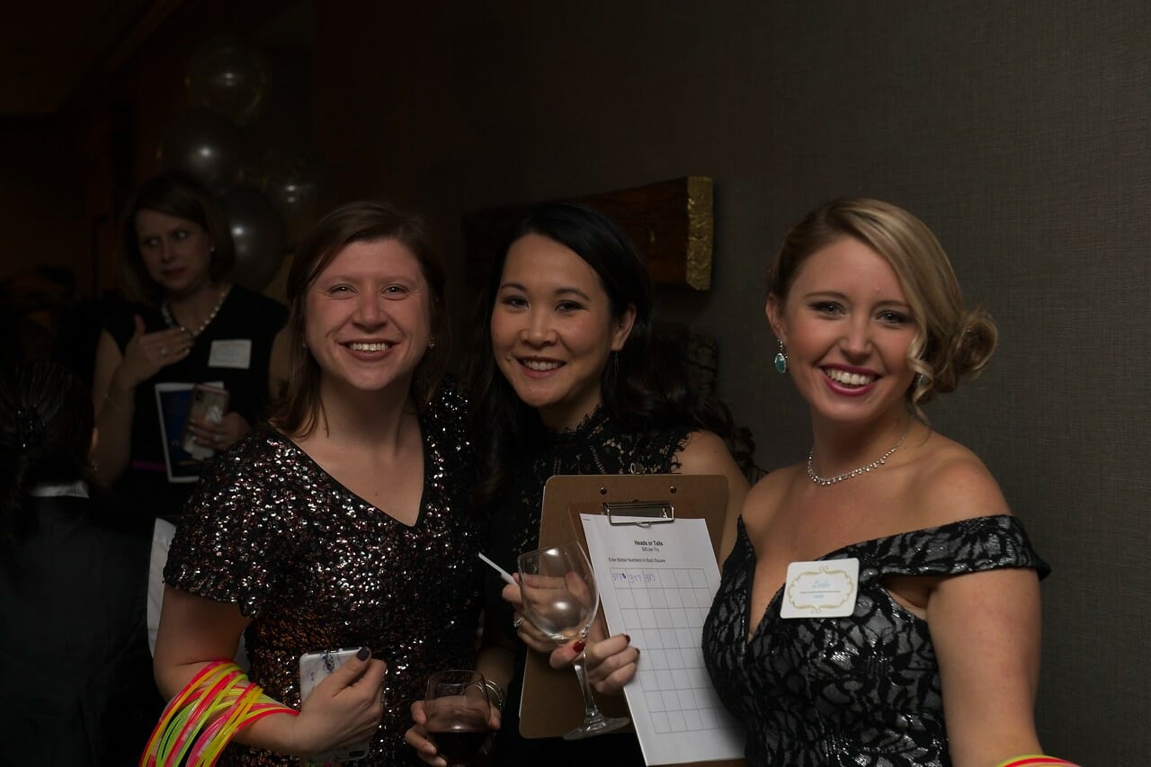 three women posing at a McLean event