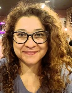 Mónica Mena-Cuellar headshot.