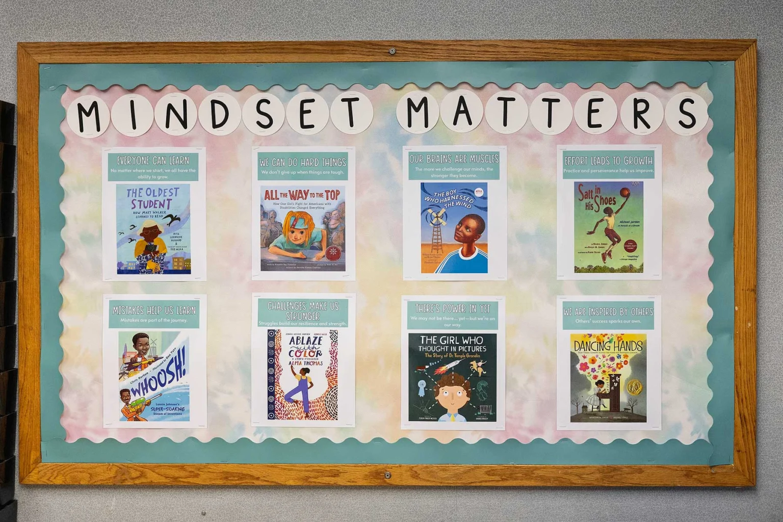 Bulletin board titled "Mindset Matters" displays eight children's books with themes related to growth, learning, and perseverance.