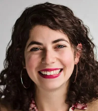 A woman smiling at the camera.